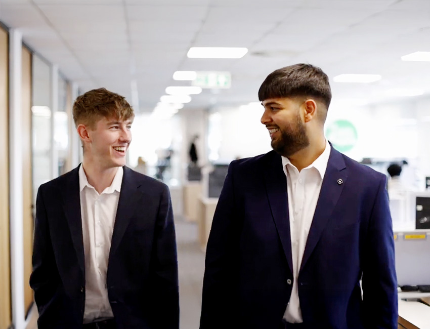 Two business students on placement in an office
