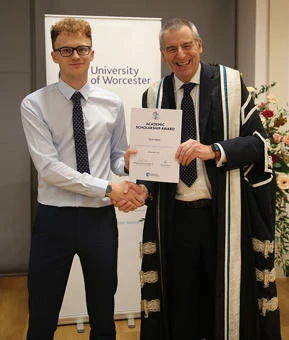 University of Worcester logo on a light blue background