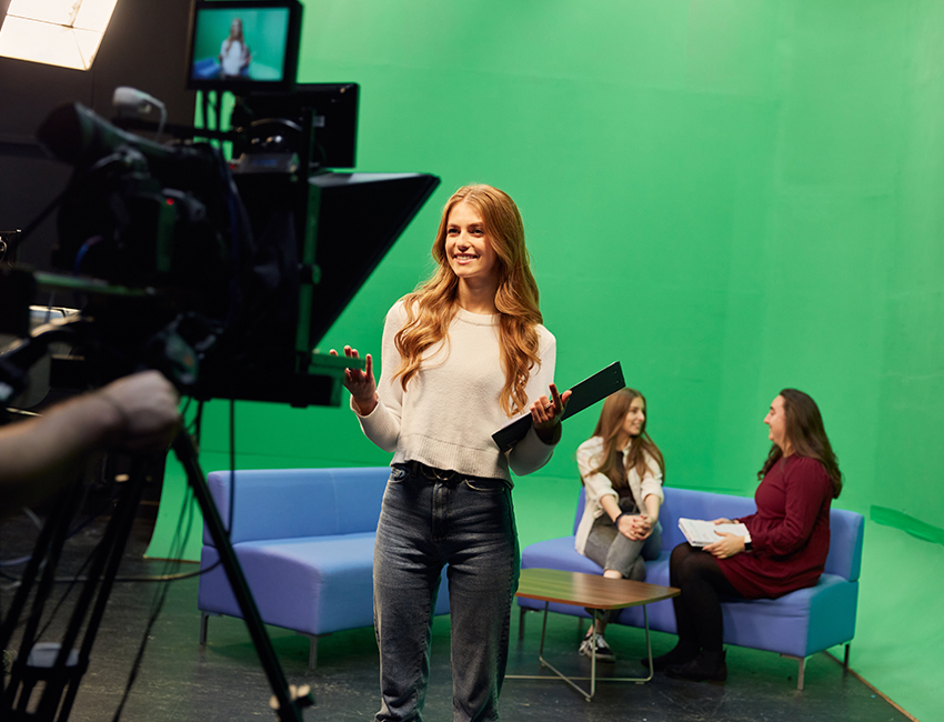 Three girls being filmed with professional camera