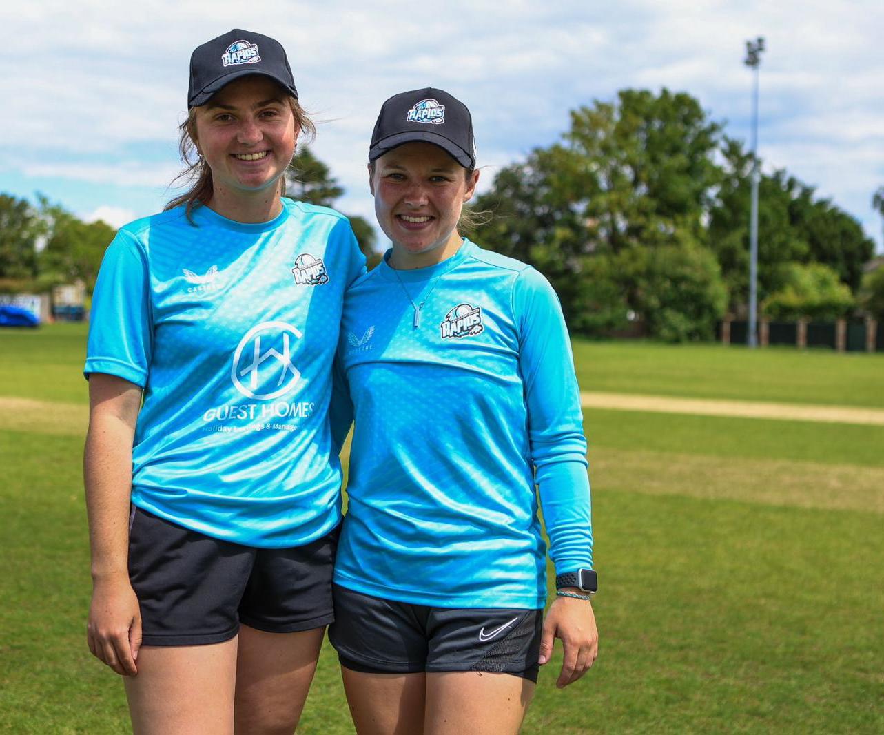 Two female cricket scholarship students