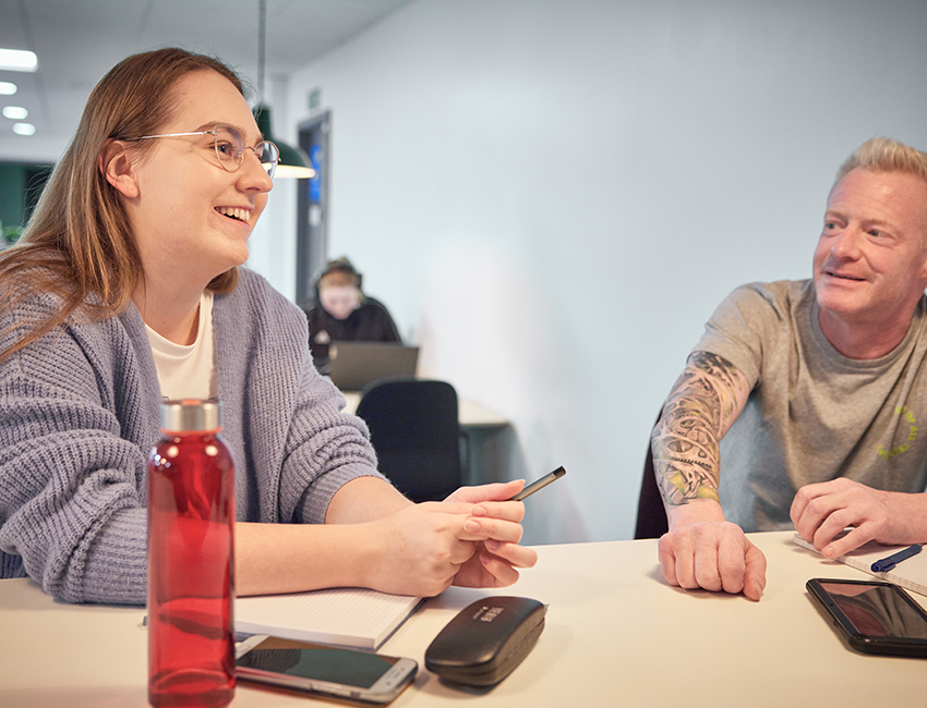 Students having a discussion around a table