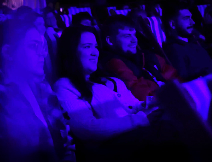 Students watching a film at the cinema together
