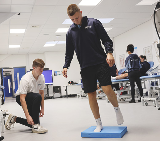 A Sports Therapy student working with a client