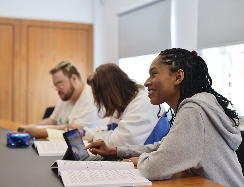 Three people in a lecture in a mock court