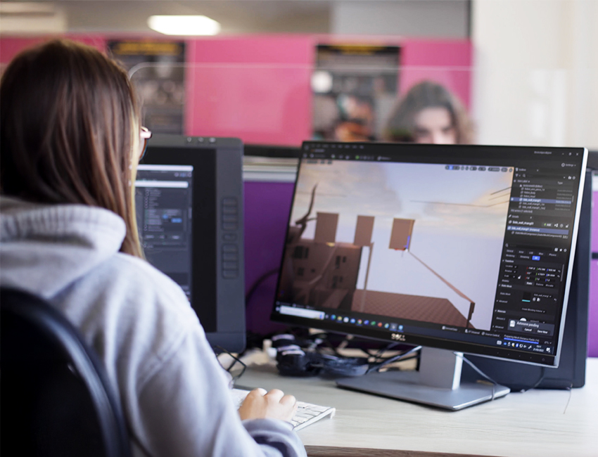 Girl working on artwork on a computer