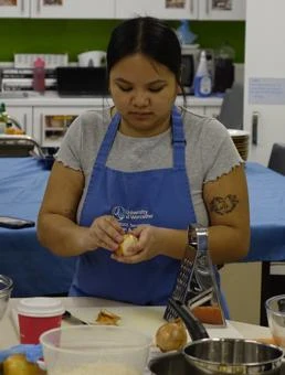 University of Worcester logo on a light blue background