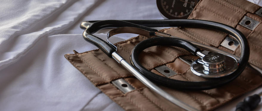 A brown stethoscope in a kit bag.