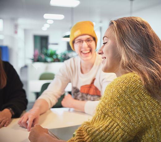 Two students laughing together