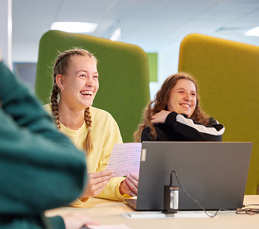 Two students with a laptop