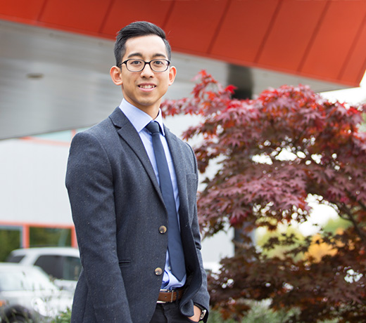 Student standing outside of his work placement