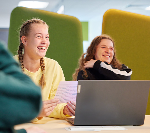 Two students with a laptop