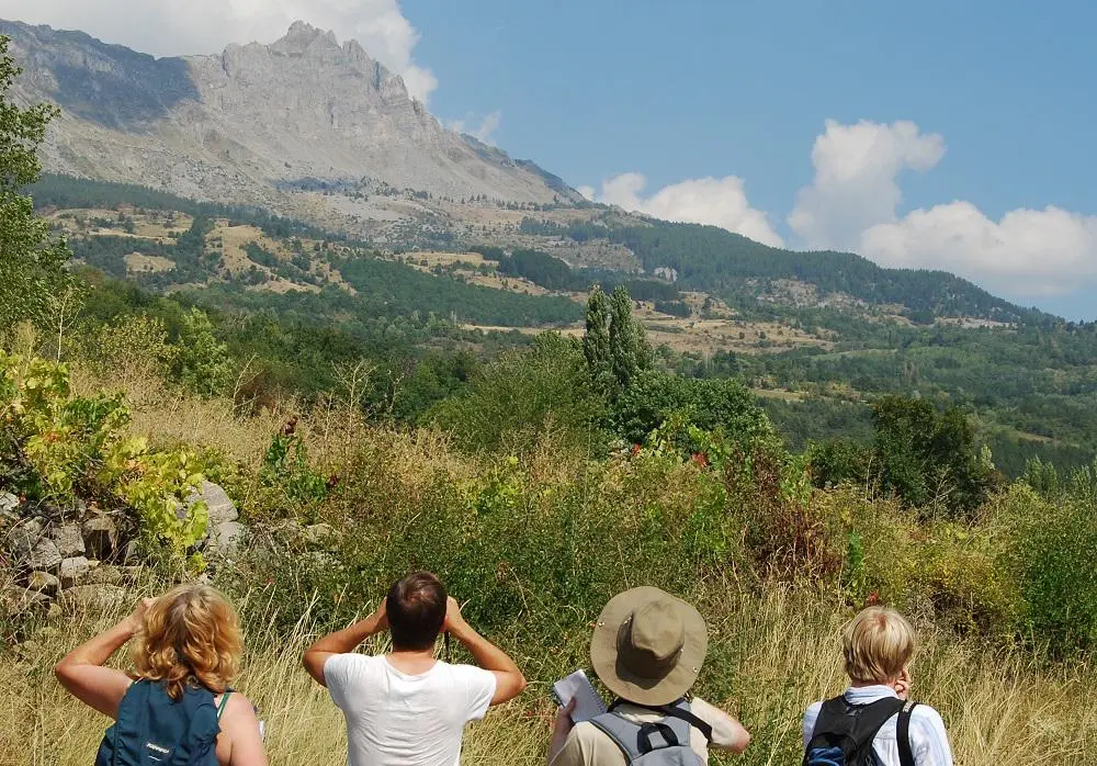 group of students looking towards a mountain