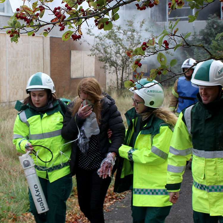 Paramedic students helping an injured person