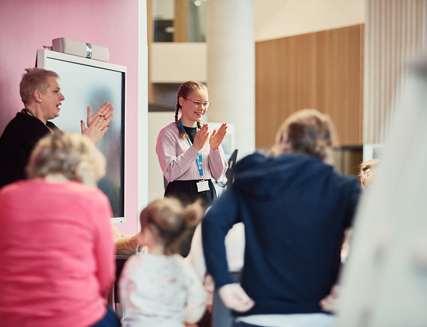 A student leading a teaching session with young children