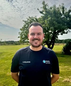 University of Worcester logo on a light blue background