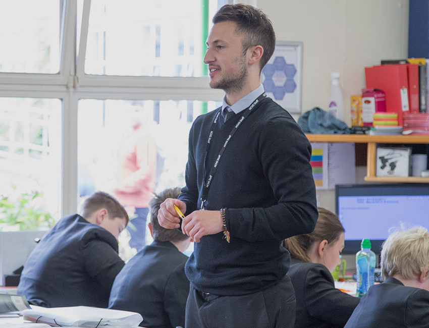 Male teacher in classroom