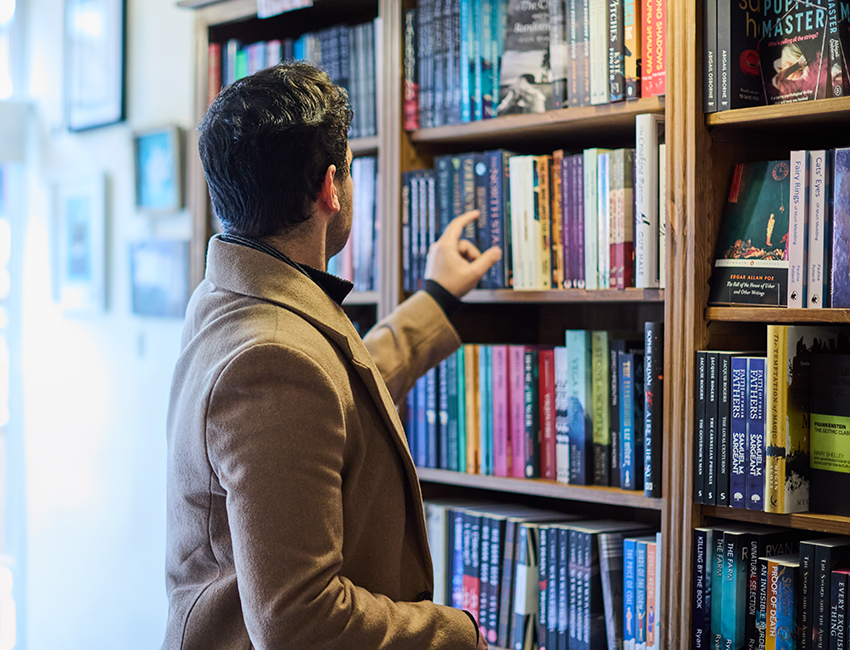 A student looking through books