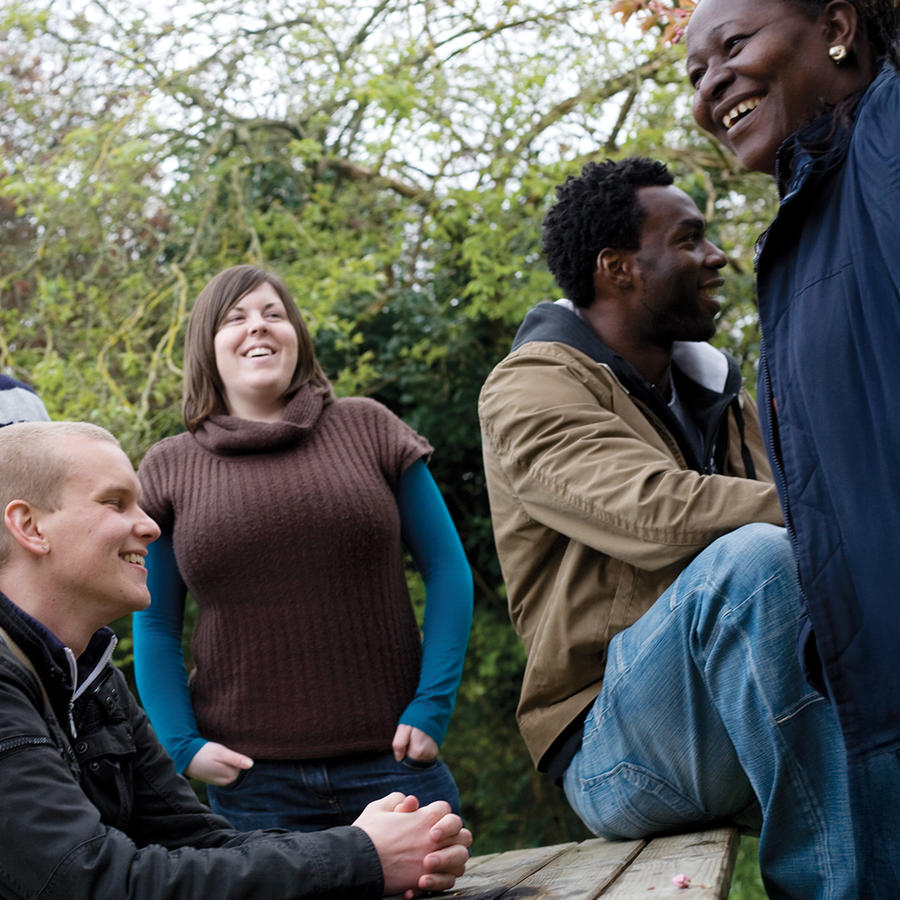 Group of friends laughing and enjoying time together outdoors