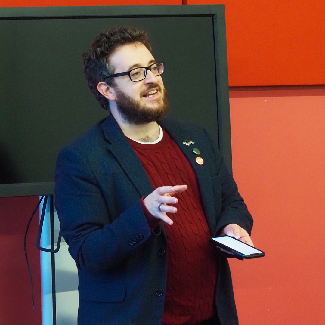 A lecturer performing poetry