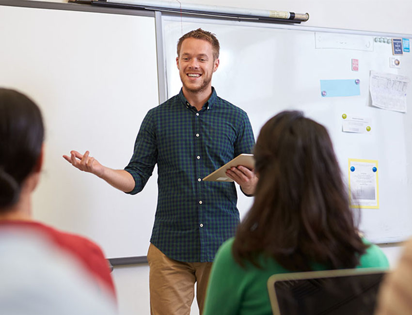 teacher stood educating students