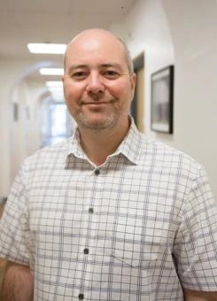 University of Worcester logo on a light blue background