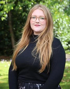 University of Worcester logo on a light blue background