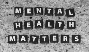 Letter tiles that spell the words: "mental health matters"