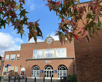University of Worcester logo on a light blue background