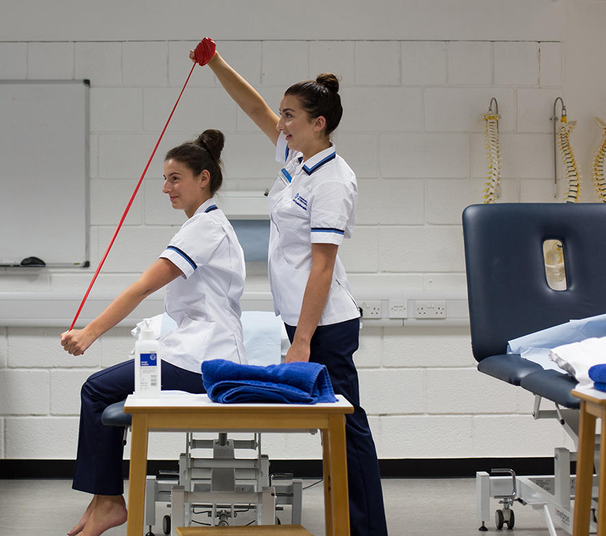 physiotherapy students practicing patient stretches