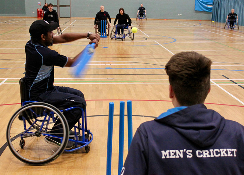 a group of students are playing wheelchair cricket at the University of Worcester