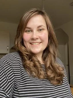 University of Worcester logo on a light blue background