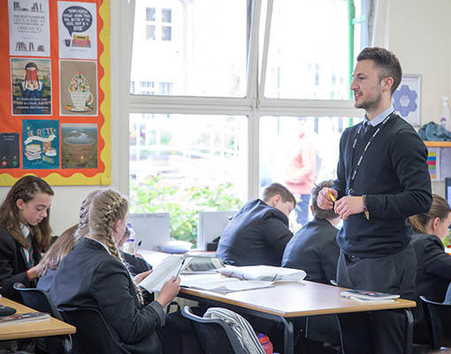 male teacher in a classroom